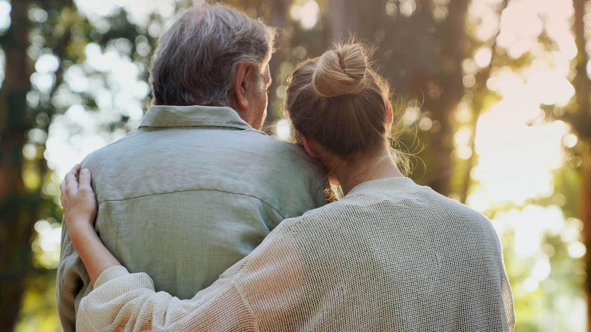 Couple hugging lovingly in the park