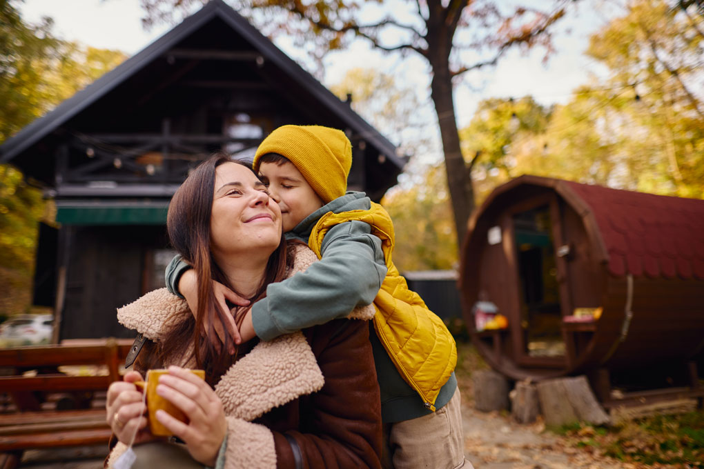 Young son hugs his mother